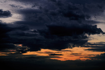 Beautiful sunset - dark sky with clouds and sunlight