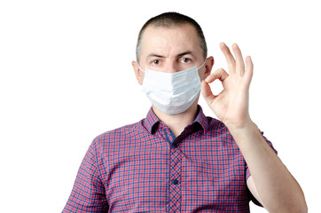 Man showing okay gesture. Photo of healthy man wears protective mask against infectious diseases and flu. Health care concept