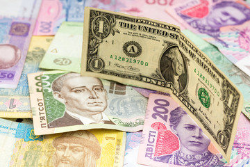 various ukrainian hryvna and one dollar banknote trade exchange concept