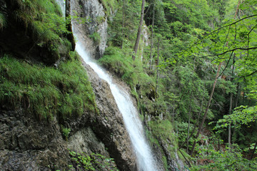 Fototapeta na wymiar Beautiful waterfalls on the tourist trail in Slovak Paradise National Park, Slovaki