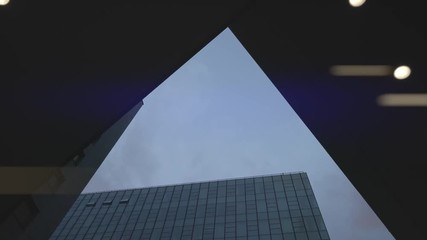 Airplane flying over skyscrapers and reflects in glass modern facades, Germany