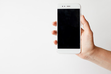 Smartphone in hand, blank screen mock up on white background