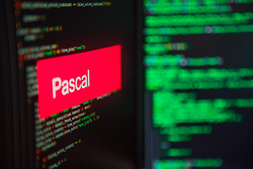 Programming language, Pascal inscription on the background of computer code.