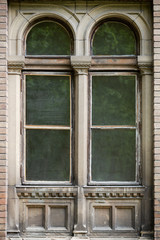 The old window in the design of stucco and patterns not restored