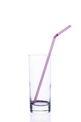 Empty glass cup with a tube for juice on a white background.