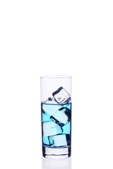 .Glass beaker is filled with a blue cocktail ice cubes on a white background.