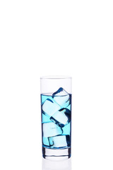 .Glass beaker is filled with a blue cocktail ice cubes on a white background.