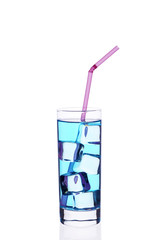 A glass cup of blue cocktail c tube ice cubes on a white background.