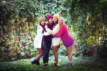 Fototapeta premium Women best friends smiling and walking at the nature. Outdoors lifestyle fashion portrait. Positive emotions.