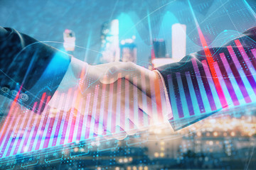 Double exposure of financial chart on cityscape background with two businessmen handshake. Concept of financial analysis and investment opportunities