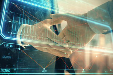 Double exposure of business theme drawing on cityscape background with handshake. Concept of partnership