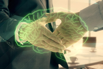 Double exposure of brain drawing on office background with two men handshake. Concept of innovation