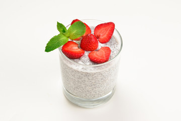 Chia pudding with strawberry and mint on a white background. Space for text or design.