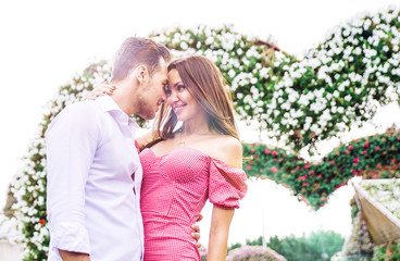 Fototapeta premium Happy couple walking in a flower park