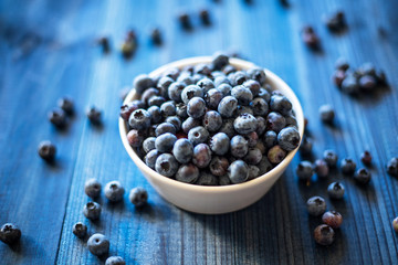 fresh blueberry on blue wooden background