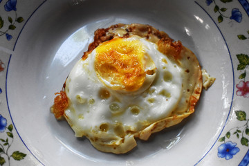 fried eggs with bacon and bacon