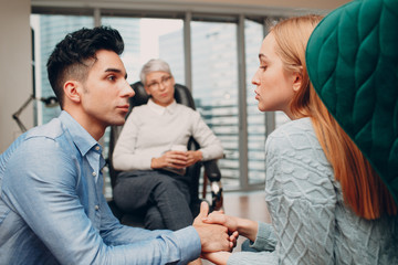 Consultation of couple young man and woman patient on reception for psychologist. Family problems