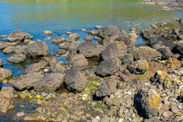 Coast of Atlantic Ocean in Ballycastle Northern Ireland. Summer sunny day, clear blue sky  