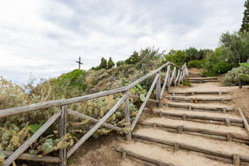 Wooden stairs way on a green garden in Italy, Tropea