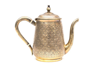 An antique silver teapot on a white background.