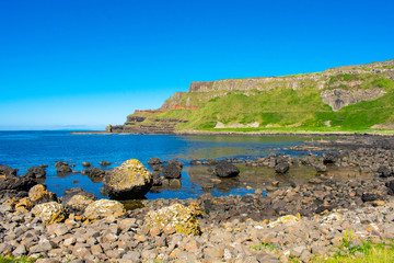 Obraz premium Giants Causeway Aerial view most popular and famous attraction in Northern Ireland.Hills on Coast of Atlantic ocean, summer time 