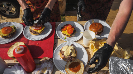Coocking bbq beef burgers in summer festival