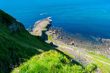 Giants Causeway Aerial view most popular and famous attraction in Northern Ireland.Hills on Coast of Atlantic ocean, summer time 