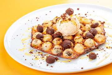 Bubble waffles with ice cream and chocolate chip cookies.