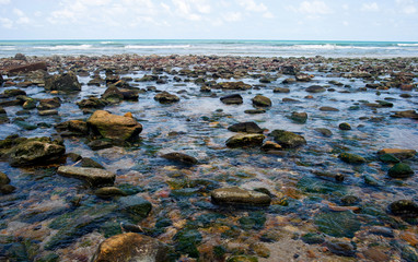 Beautiful seaside boulders and bright sea water