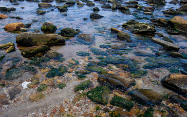 Beautiful seaside boulders and bright sea water