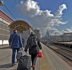 Passengers arrived in Moscow go to the exit to the city along the platform at the Kiev railway station