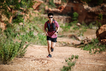 man running trail in the mountain
