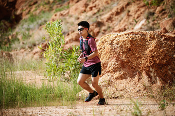 trail runner running on the rocky road