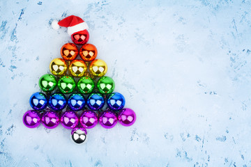 Christmas tree decorations glass balls LGBTQ community rainbow flag colors, Santa Claus hat, LGBT pride symbol, New Year holiday greeting card design, lesbian and gay xmas night party sign, copy space