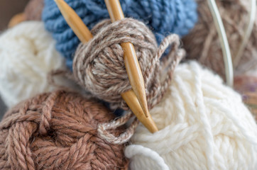 Crochet and knitting set. Yarn balls and wood needles. Homemade hobby concept.