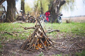 Bonfire and bikes in the background. The concept of a healthy lifestyle and leisure with a bicycle.