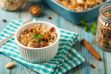 Traditional, mexican baked sweet rice, with almonds, raisins and walnuts.