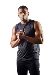 Pensive serious handsome guy keeps palms near his chest, making up a plan, making solution, isolated over white background. close eup portrat.