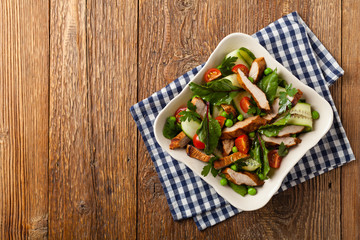 Delicious salad with grilled veal, beetroot and cucumber. Top view.