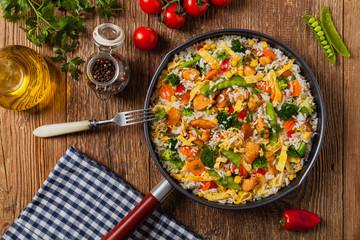 Nasi goreng. Fried rice with egg and vegetables.