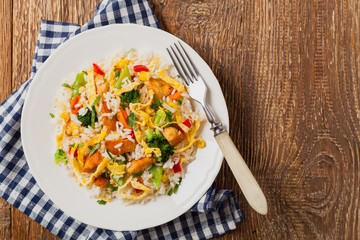 Nasi goreng. Fried rice with egg and vegetables.