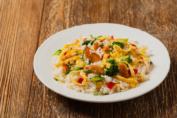 Nasi goreng. Fried rice with egg and vegetables.