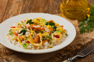 Nasi goreng. Fried rice with egg and vegetables.