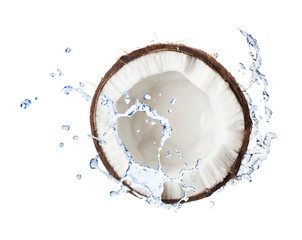 Cracked coconut with water splashes on whitebackround