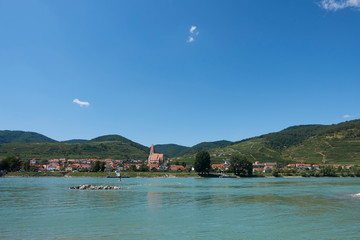 The beautiful village Weissenkirchen on the Danube in the Wachau surrounded by vineyards