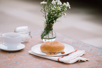 cup of coffee with bread on table in the morning with sunlight, breakfast