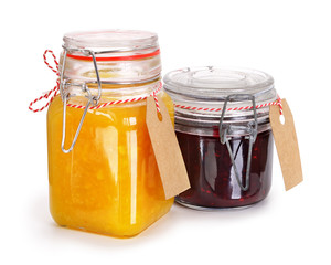 Two glass jars with jam isolated on white. Contains clipping path.