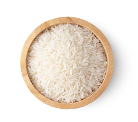 rice seeds in wood bowl isolated on white background. top view