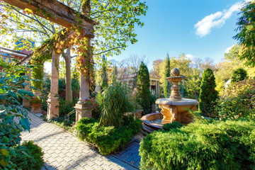 Antique columns, antique fountain and temple of Zeus in the Old Park in the village of Kabardinka,...