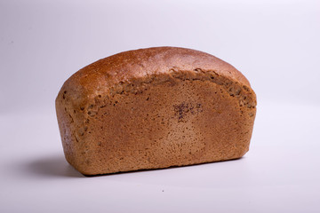 Gray bread on a white background. Baking for food